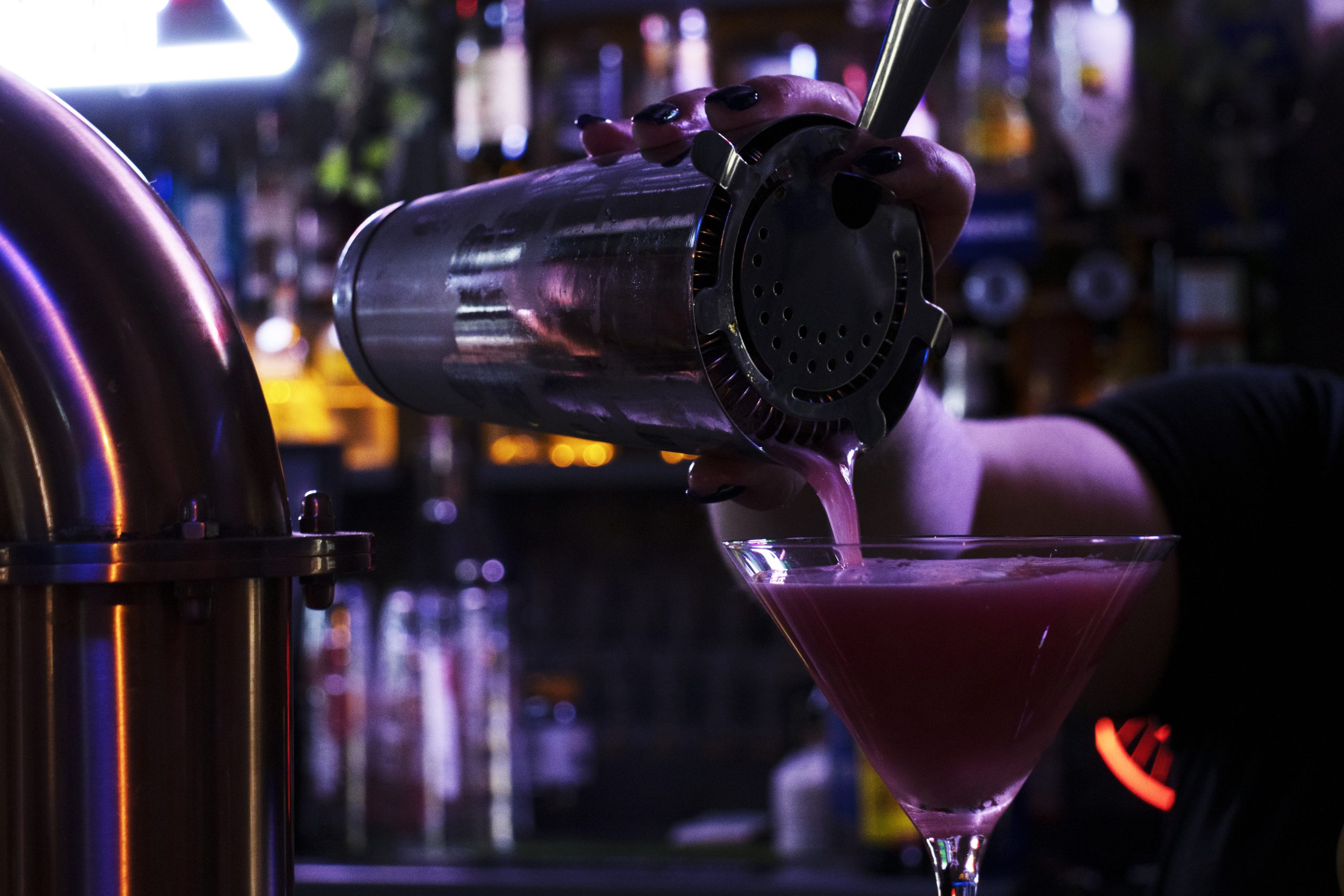 Bartender pouring cocktails